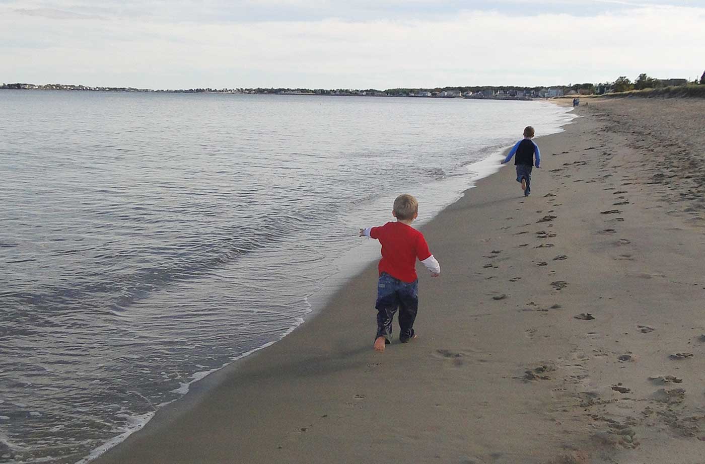 children running along beach
