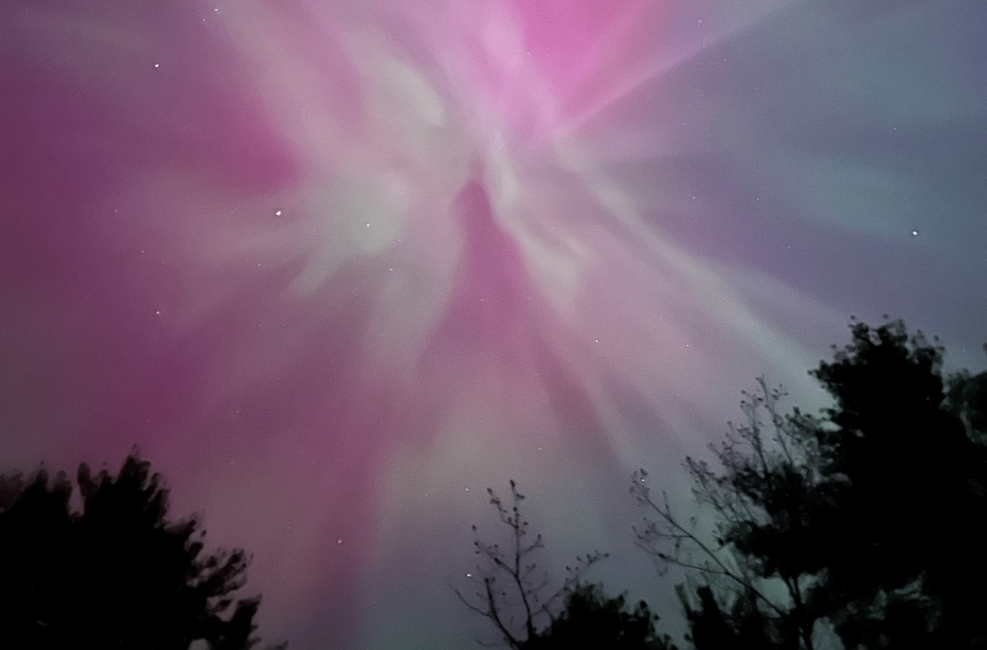 pink night sky from aurora borealis