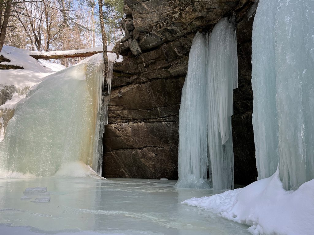 frozen waterfall down to frozen pond