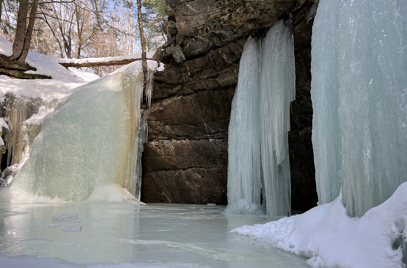 frozen waterfall down to frozen pond