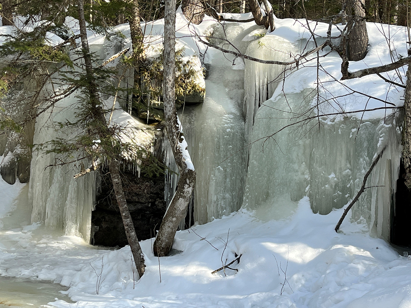 frozen waterfall down to frozen pond